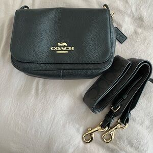 Black leather Coach crossbody with Coach brown logo shoulder strap